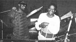 Why are these men laughing? Stevie Wonder(L) is amused.  Herbie Hancock (R) is relieved.  Days later, America learns why.